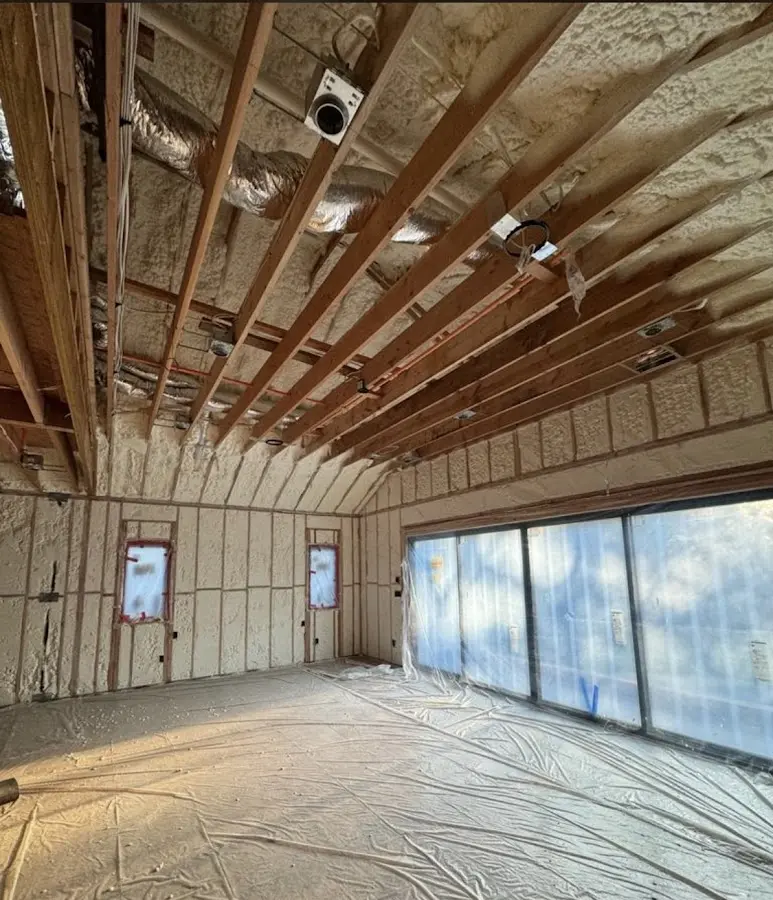 Interior walls and ceiling insulated with spray foam during new construction in Smithfield